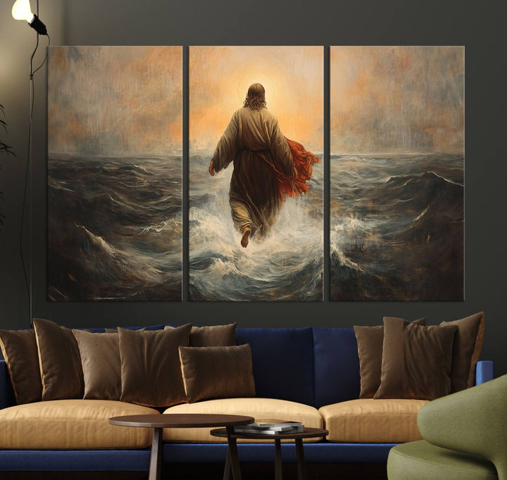 A modern living room is adorned with a triptych titled "Jesus Walking on Water, Christian Wall Art, Jesus Christ Walking on Oil Painting Style Print." The artwork, presented on museum-quality canvas, showcases vibrant colors and exquisite detail.