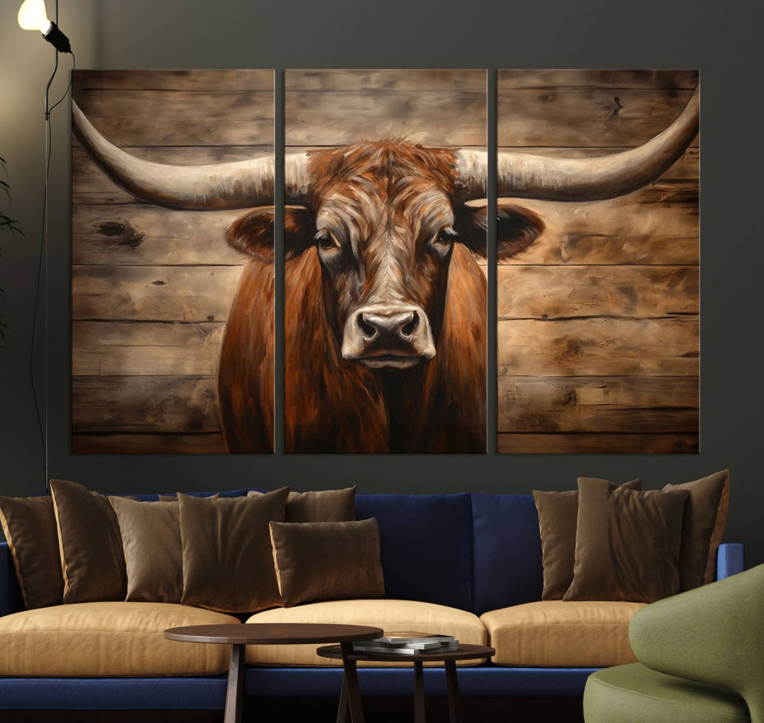 The Longhorn Bull Wall Art, a ready-to-hang canvas print, showcases an image of a brown longhorn cow set against a wooden background, perfect for those looking to enhance their space with rustic farmhouse and western barn decor.