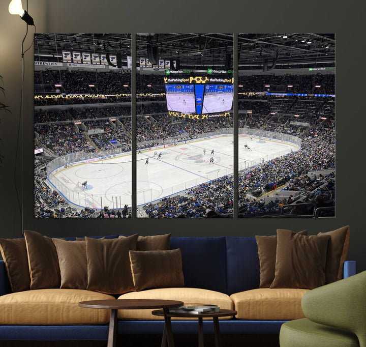 A large Enterprise Center canvas of a crowded hockey arena hangs prominently.