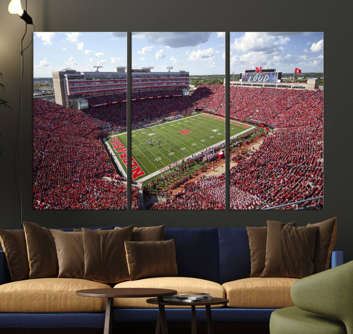 The University of Nebraska Cornhuskers Football Team Print showcases a vibrant triptych of Lincoln Memorial Stadium, depicting a packed football stadium filled with energetic fans. This handmade art piece is crafted in the USA and printed on premium canvas for a gallery-quality finish.