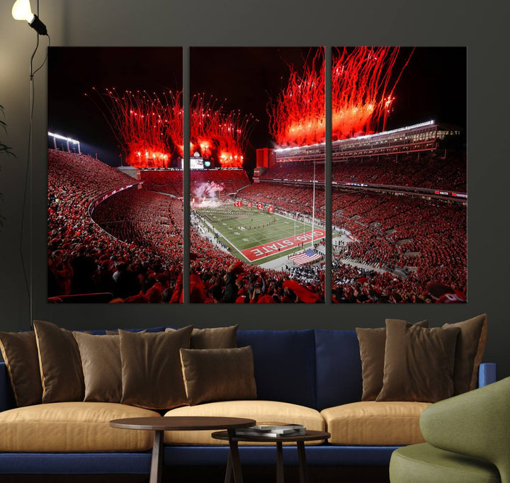 A vibrant red canvas art of a packed Ohio State Buckeyes stadium at night with fireworks.