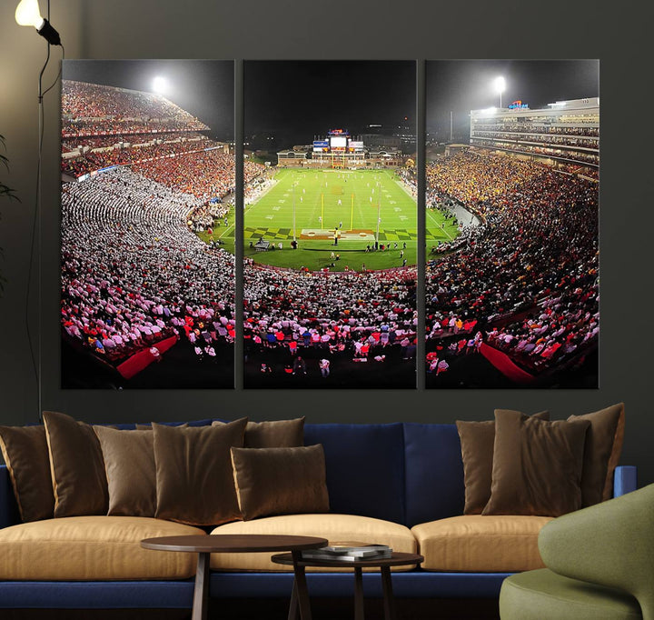 The Maryland Terrapins Football Wall Art Canvas showcases a packed SECU Stadium at night with a bright field and cheering fans.