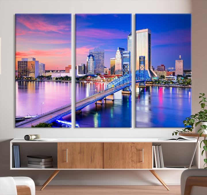 The Jacksonville Wall Art Canvas Print, showcasing the Jacksonville cityscape over a river at sunset, is elegantly crafted on museum-quality canvas with a UV-protective coating. Ready to hang, it elevates your space with its sophisticated charm.