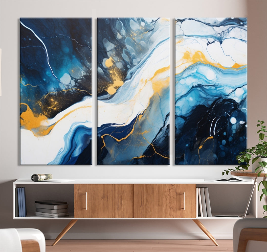 The Navy Blue Abstract Wall Art Canvas Print, displaying an exquisite array of blue, white, and gold swirls, is crafted on museum-quality canvas and enhances the space with its sophisticated elegance.