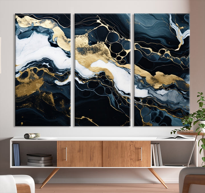 Fluid Marble Abstract Wall Art Print, a contemporary piece with black, white, and gold swirls on museum-quality canvas.