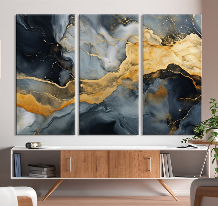 The living room features the Golden Gray Abstract Wall Art Print Contemporary Art Canvas Design, a triptych showcasing gold, black, and gray swirls. Crafted on museum-quality canvas and ready to hang, this piece is designed for elegance and durability.