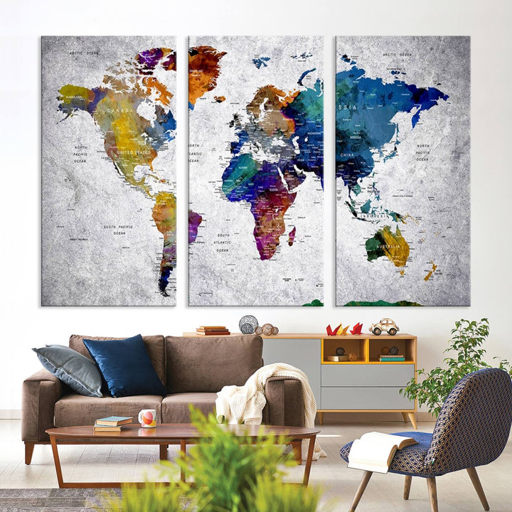 The World Map Art Canvas Print, featuring country names on a grunge-stained gray background, is perfect for stylish home decor.