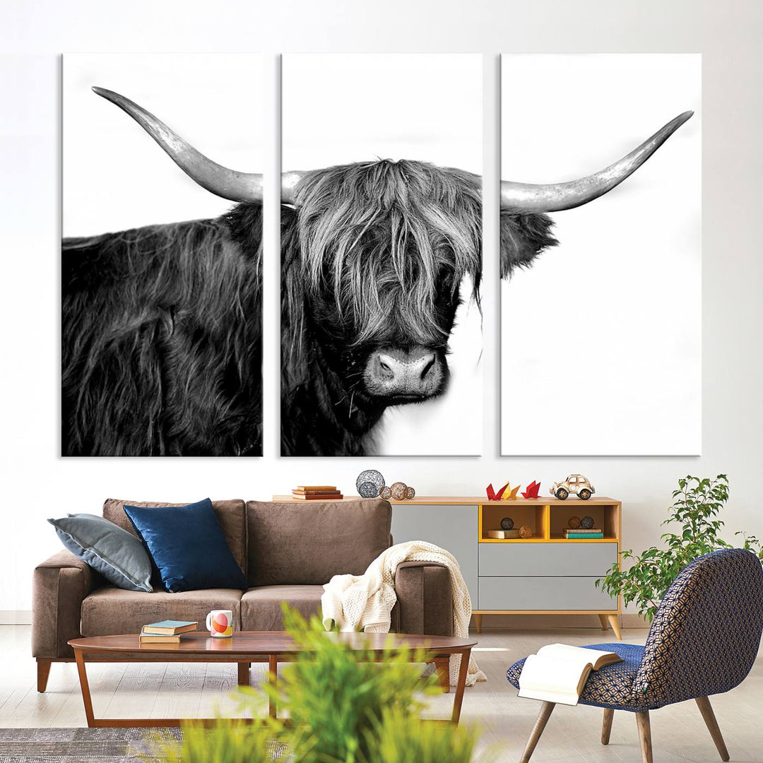 The Black and White Highland Cow Multi Panel Wall Art Canvas Print with UV-protection hangs prominently.