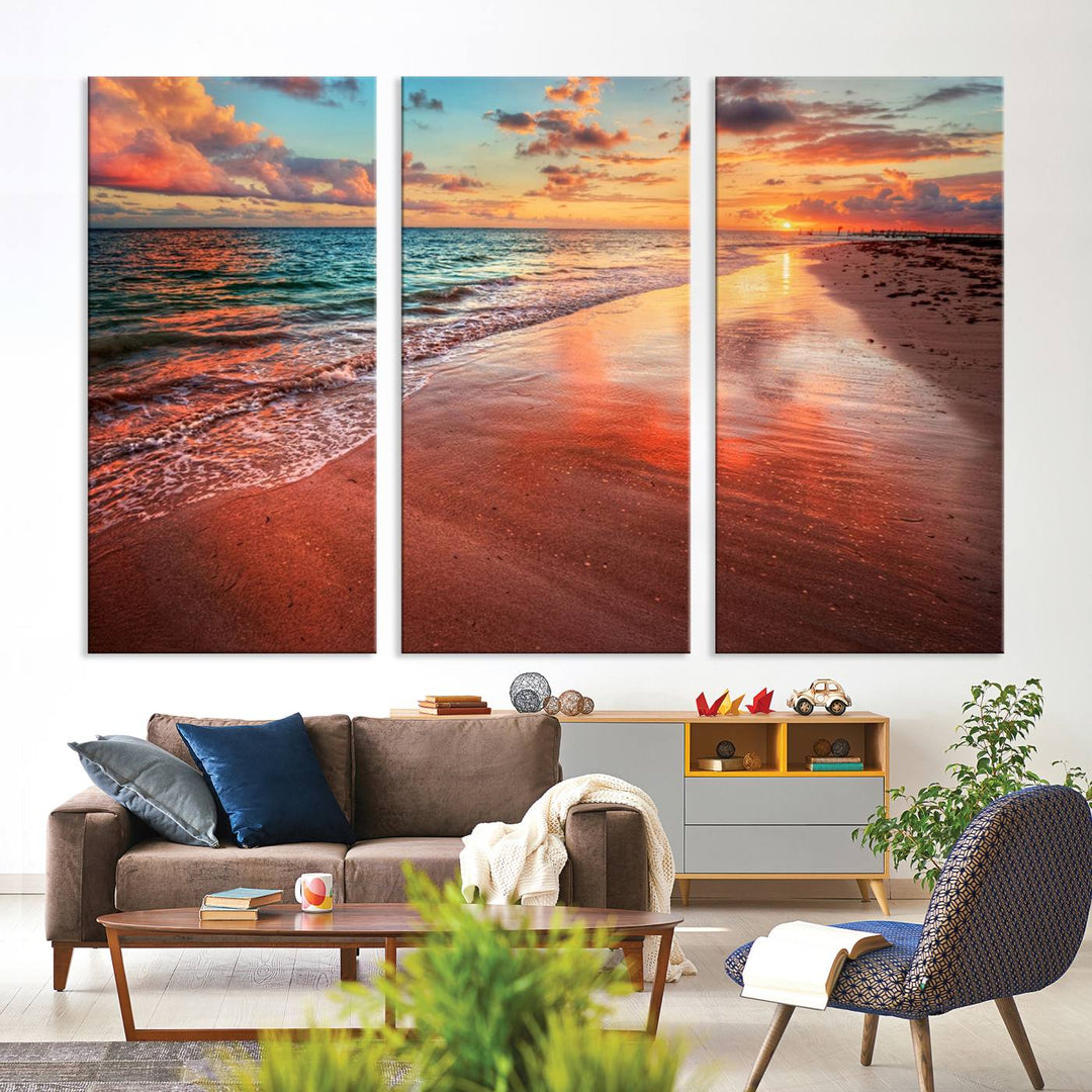 A Vibrant Sunset Beach Canvas Print with ocean waves and sandy shoreline enhances coastal-themed interiors.