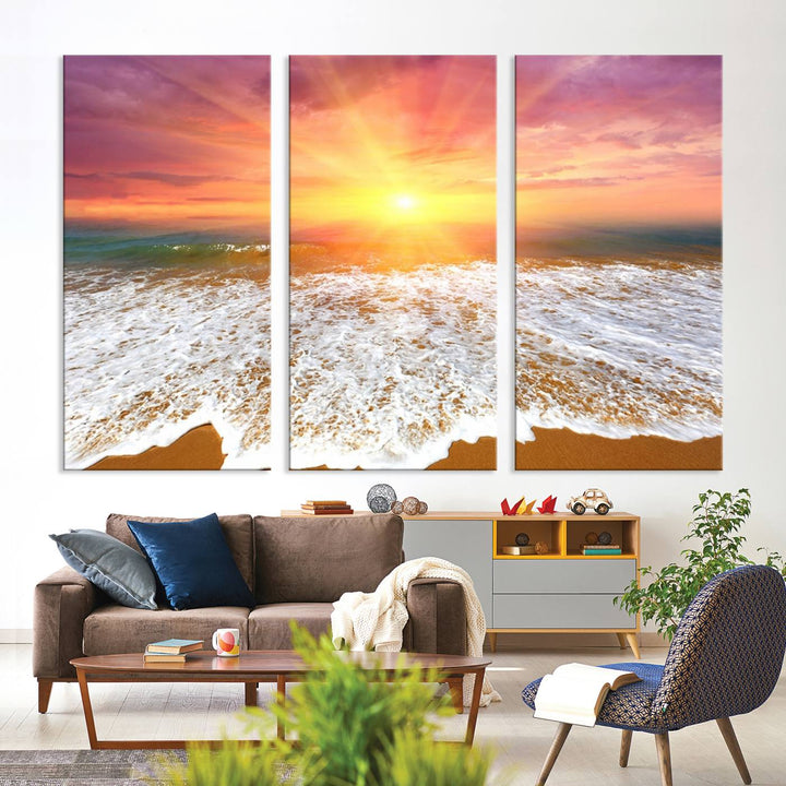 Golden Beach Sunrise 3-panel canvas art of ocean waves, hung on a wooden wall.