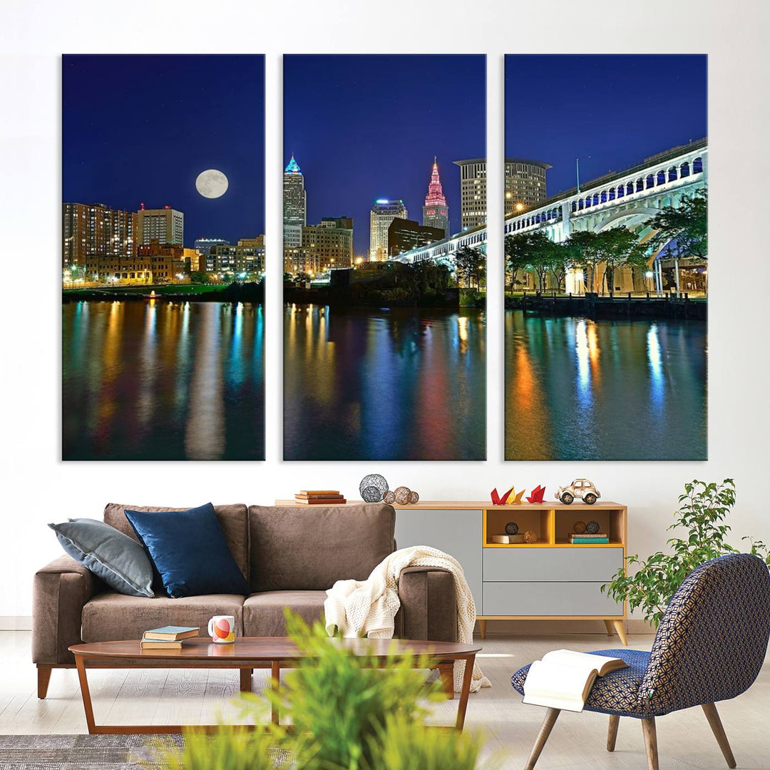 Cleveland City Lights Night Skyline Wall Art canvas showcases a moonlit cityscape reflected on water.