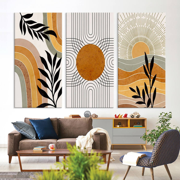 The Modern Boho Sun and Leaf giclée canvas is a 3-panel piece designed for mid-century or bohemian decor.