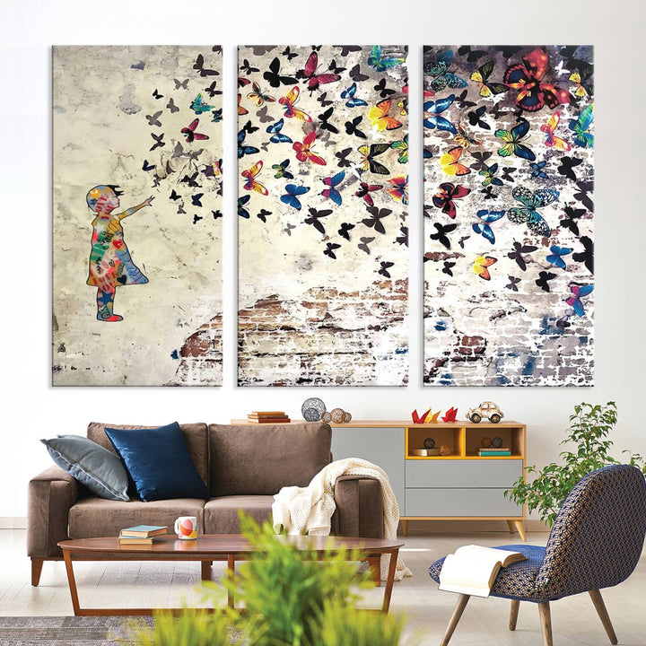 A Banksy Girl Butterfly Canvas Print is displayed on the textured wall.