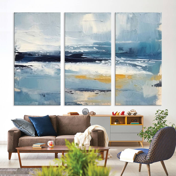 The Abstract Ocean Canvas Wall Art in coastal blue and gold enhances the modern kitchen.