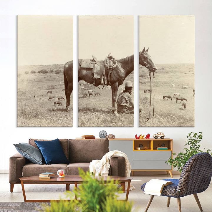 Cowboy Wall Art - Vintage Western Horse Canvas Print features a cowboy kneeling by his horse in a field.