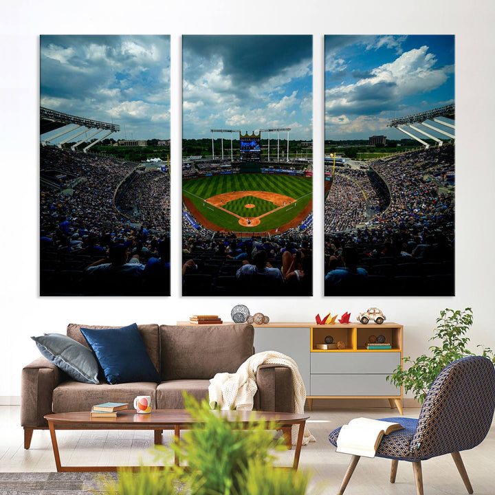 A 3-panel print of Kauffman Stadium, showcasing a crowded baseball field under cloudy skies.