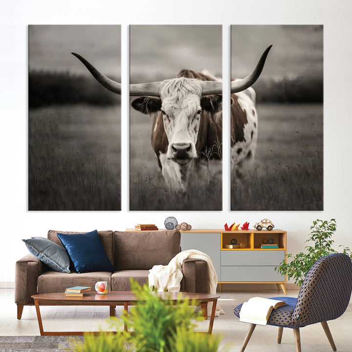 The Texas Longhorn Cow Canvas Wall Art Print adds a rustic touch to a living room.