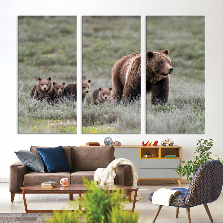 The large canvas print titled "Queen of the Tetons, 399 Grizzly Bear Cubs" showcases majestic wildlife photography of a bear and her cubs walking through the grass. This stunning canvas wall art, handmade in the USA, adds a charming touch to any room with its rustic decor appeal.