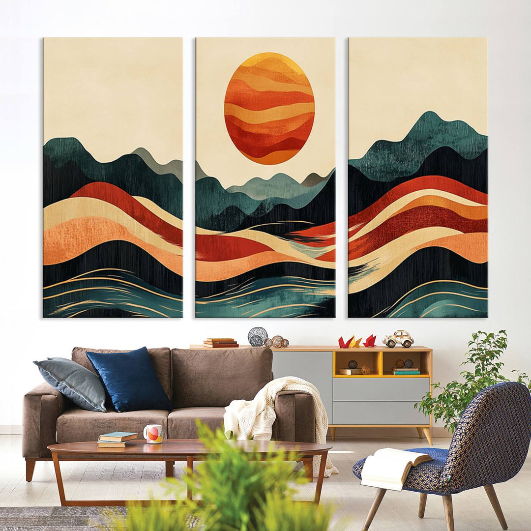 The Mountain Triptych wall art, featuring a design of the sun, mountains, and waves, is displayed prominently on the wall.