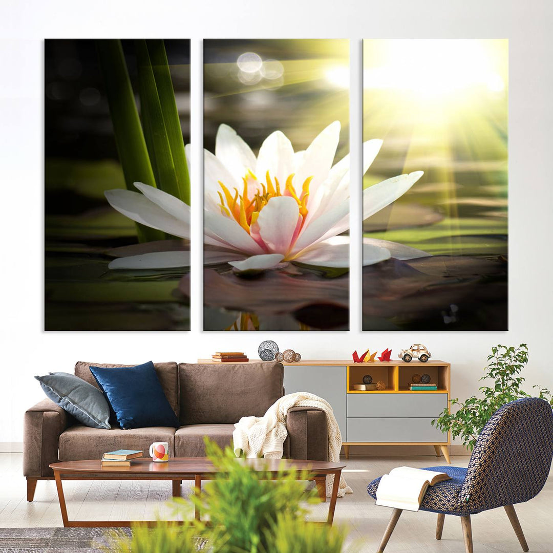 The Lotus Flower Wall Art Canvas Print showcases a white water lily with a yellow center floating gracefully in sunlight.