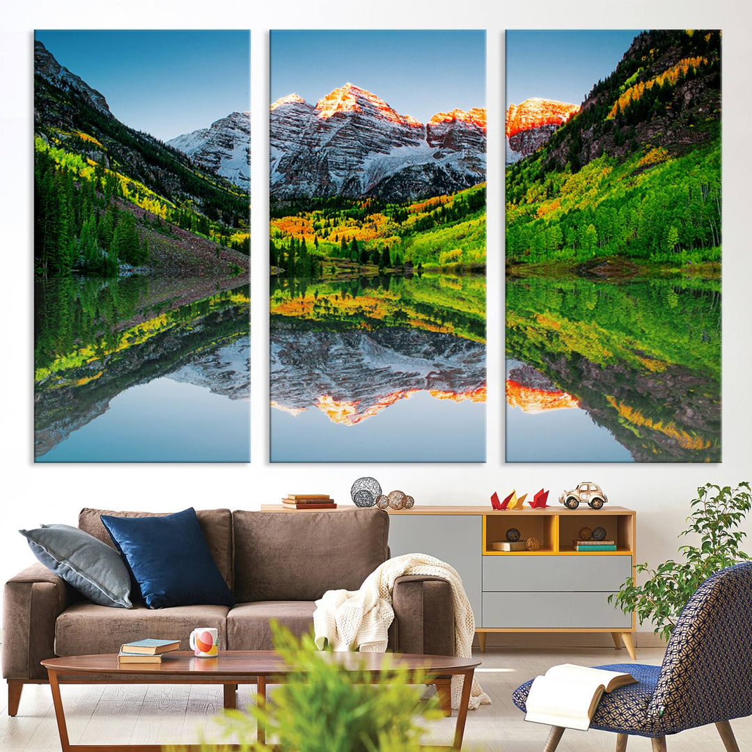 The Sunrise Maroon Bells Lake Wall Art Print beautifully captures North Maroon Peak mirrored in the tranquil lake, framed by lush greenery.