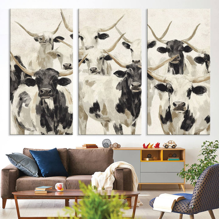 Canvas print titled Longhorn Texas Cow Drawing, depicting longhorn cattle with black and white markings, made in the USA, displayed on the wall.