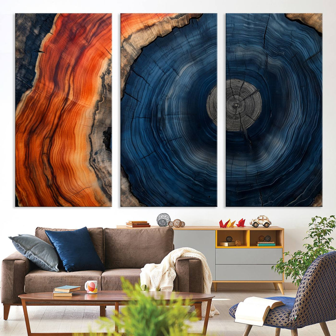 Abstract Tree Ring Wall Art Print on canvas featuring vibrant blue, orange, and brown rings with a natural rustic wood texture. Free shipping available!.