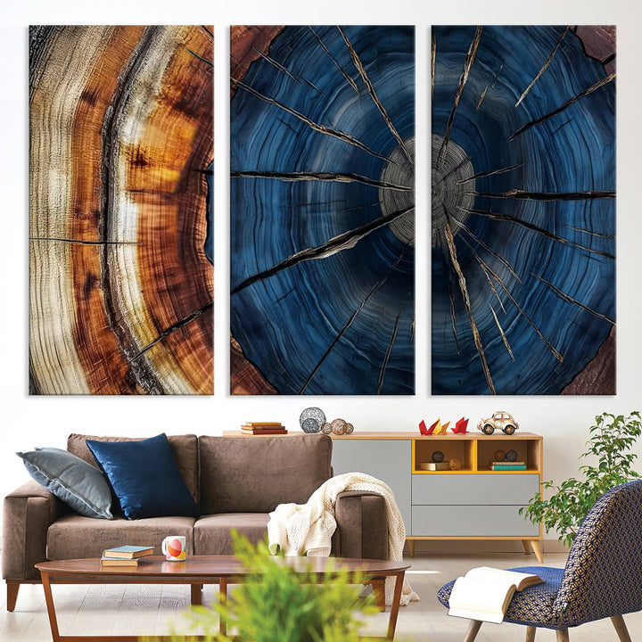 The Abstract Tree Rings Canvas Print features blue, brown, and orange rings that highlight wood grain and natures beauty.