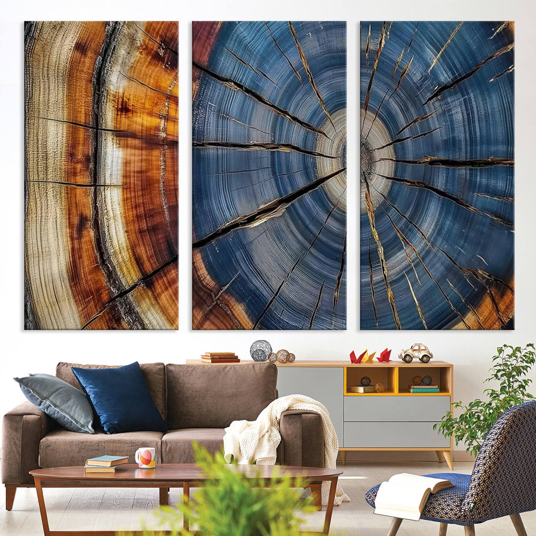 Close-up of blue, brown, and orange wood grain rings on the Abstract Tree Rings Canvas Wall Art Print.