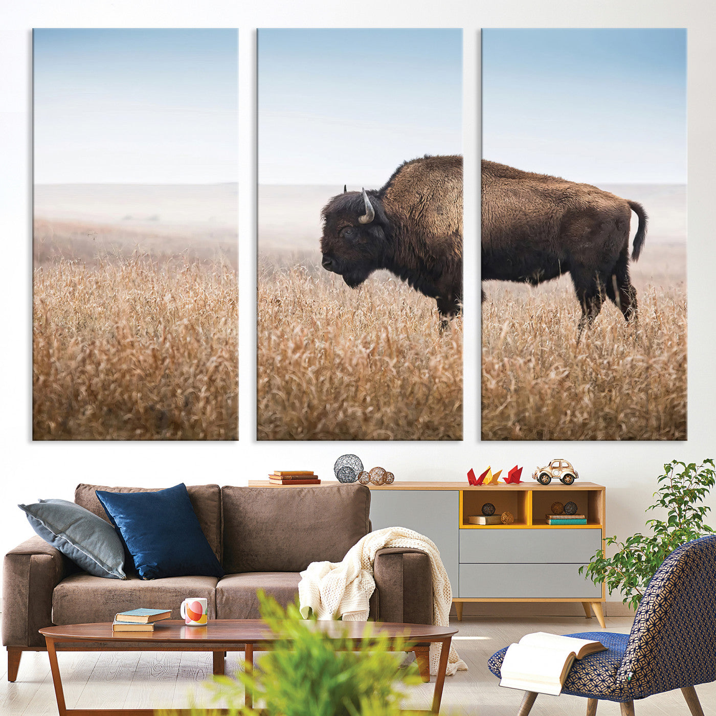 A solitary American bison stands in a dry grassland under soft skies, ideal for rustic or western-style home decor in warm neutral tones.