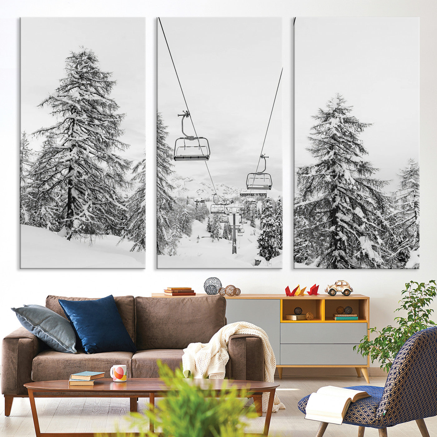 Black and white image of a ski lift amidst snow-covered pine trees, ideal for winter mountain or cabin-themed decor.