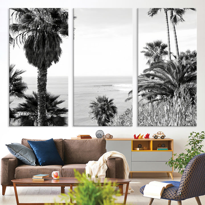 Monochrome canvas of palm trees framing a coastal surf scene, perfect for California-inspired or retro black-and-white beach decor.