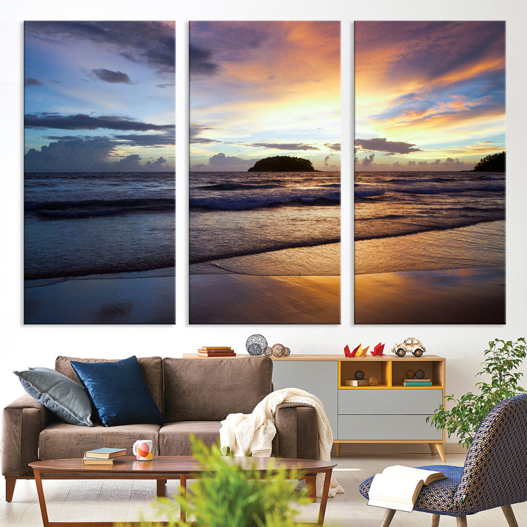 A tropical beach at sunset with waves gently washing ashore, reflecting golden and purple hues in the sky, creating a tranquil coastal scene.
