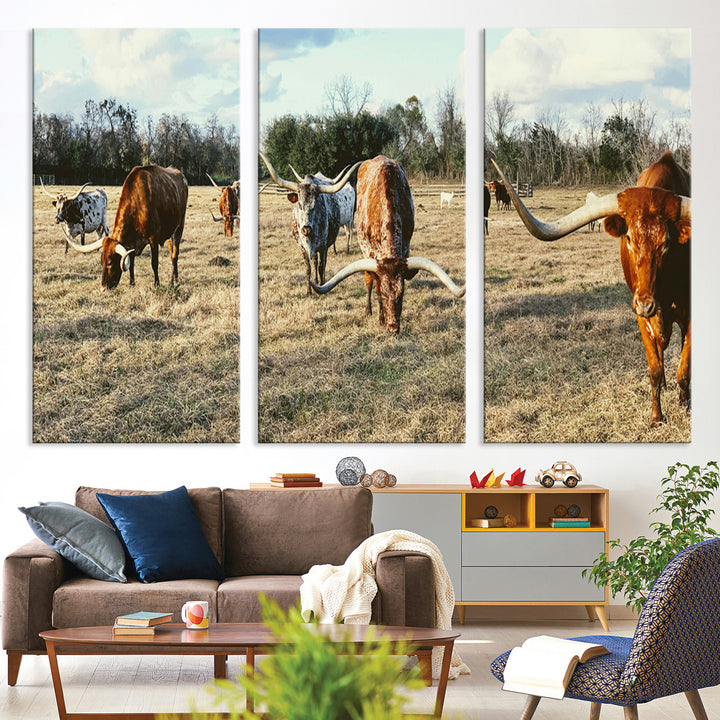 A herd of Texas Longhorn cattle grazing in an open field under a partly cloudy sky, capturing a rustic and Western ranch aesthetic.