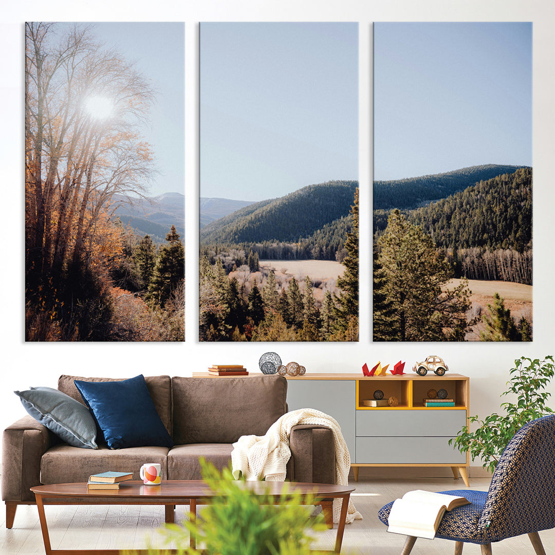 A scenic mountain valley with pine trees and autumn foliage under a clear sky, bathed in golden sunlight, creating a peaceful and rustic landscape.