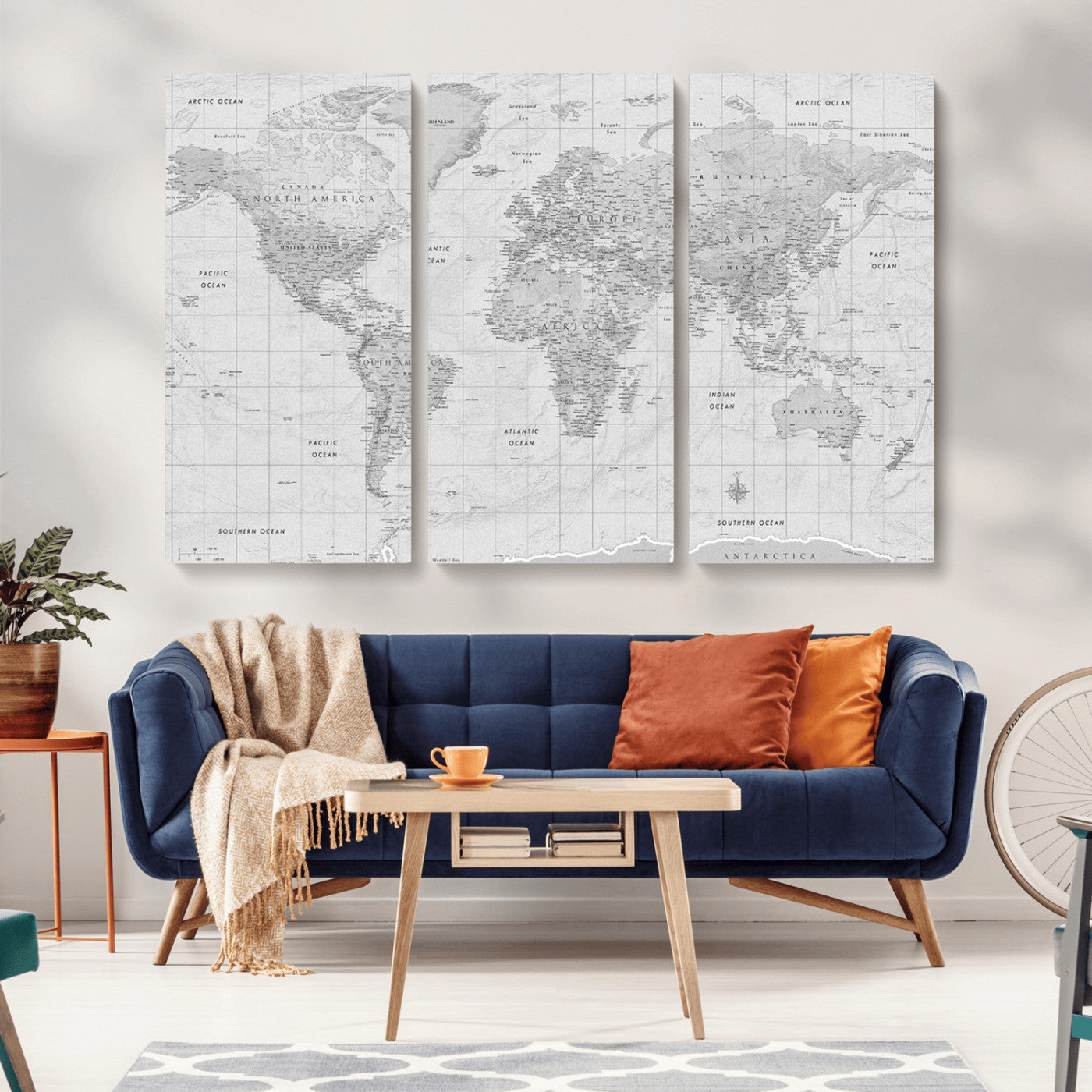 Grayscale vintage world map with detailed country borders, oceans, continents, and major cities on a textured parchment background.