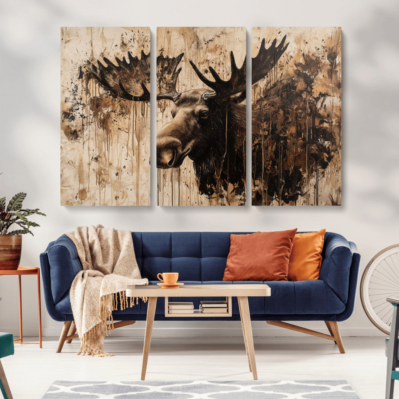 Artistic painting of a moose head with large antlers in shades of brown and black, with paint splatters and drips on a beige textured background, creating a rustic and expressive wall art canvas.