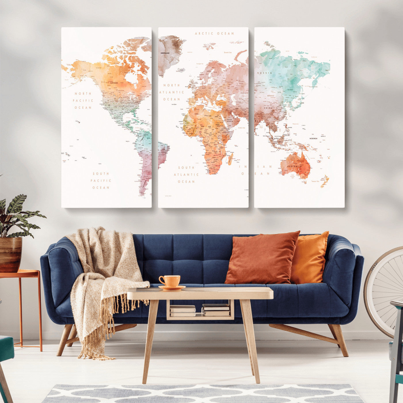 Watercolor world map featuring soft pastel hues in orange, green, blue, and purple on a light background, printed on canvas for vibrant and artistic wall decor.