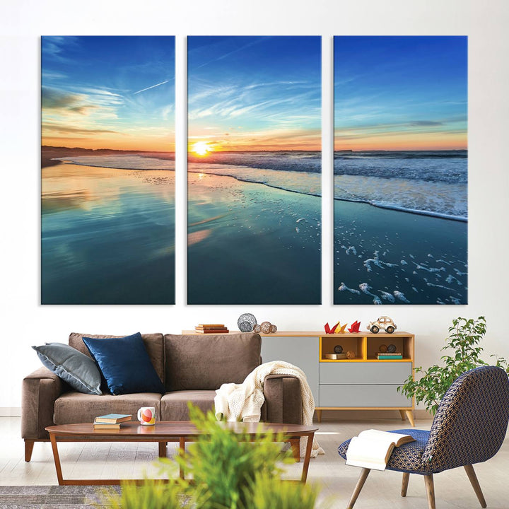 The Blue Sky and Beach Wall Art Canvas Print features a vibrant orange sky reflecting on wet sand.