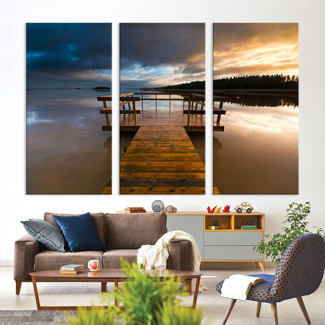 The "Serene Lake Pier at Sunset" landscape canvas print, crafted as ready-to-hang and framed wall art, enriches the contemporary setting by capturing the tranquility of a lakeside pier at sunset.