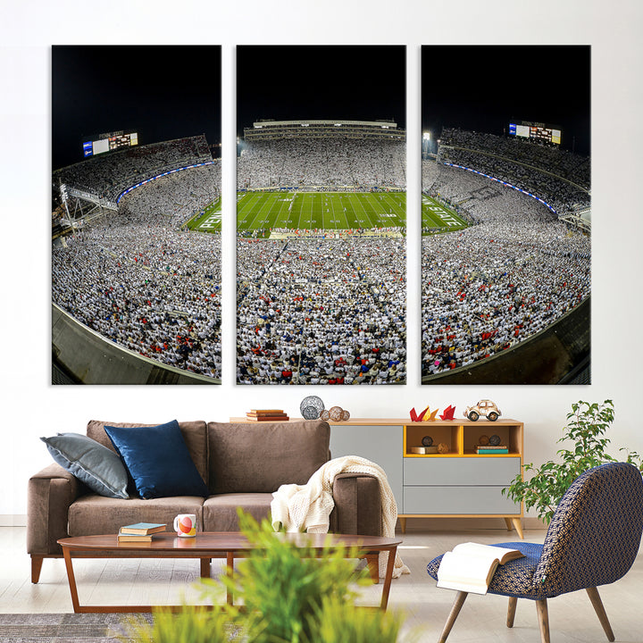 The Beaver Stadium Night Game Triple Canvas Wall Art - Penn State Nittany Lions Football Match features a panoramic view of a packed Beaver Stadium at night.