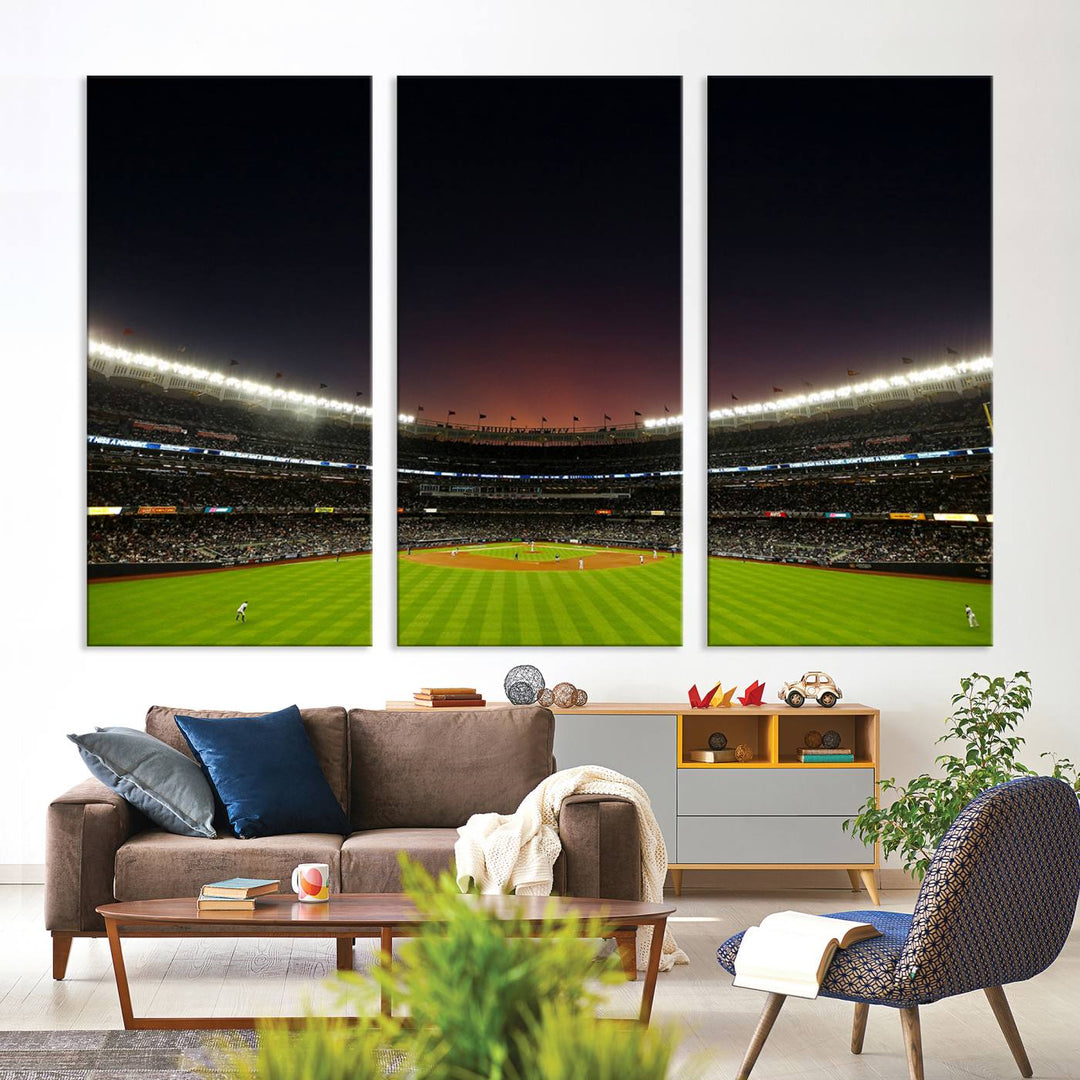 A night game at Yankee Stadium depicted on canvas beneath a sunset sky.