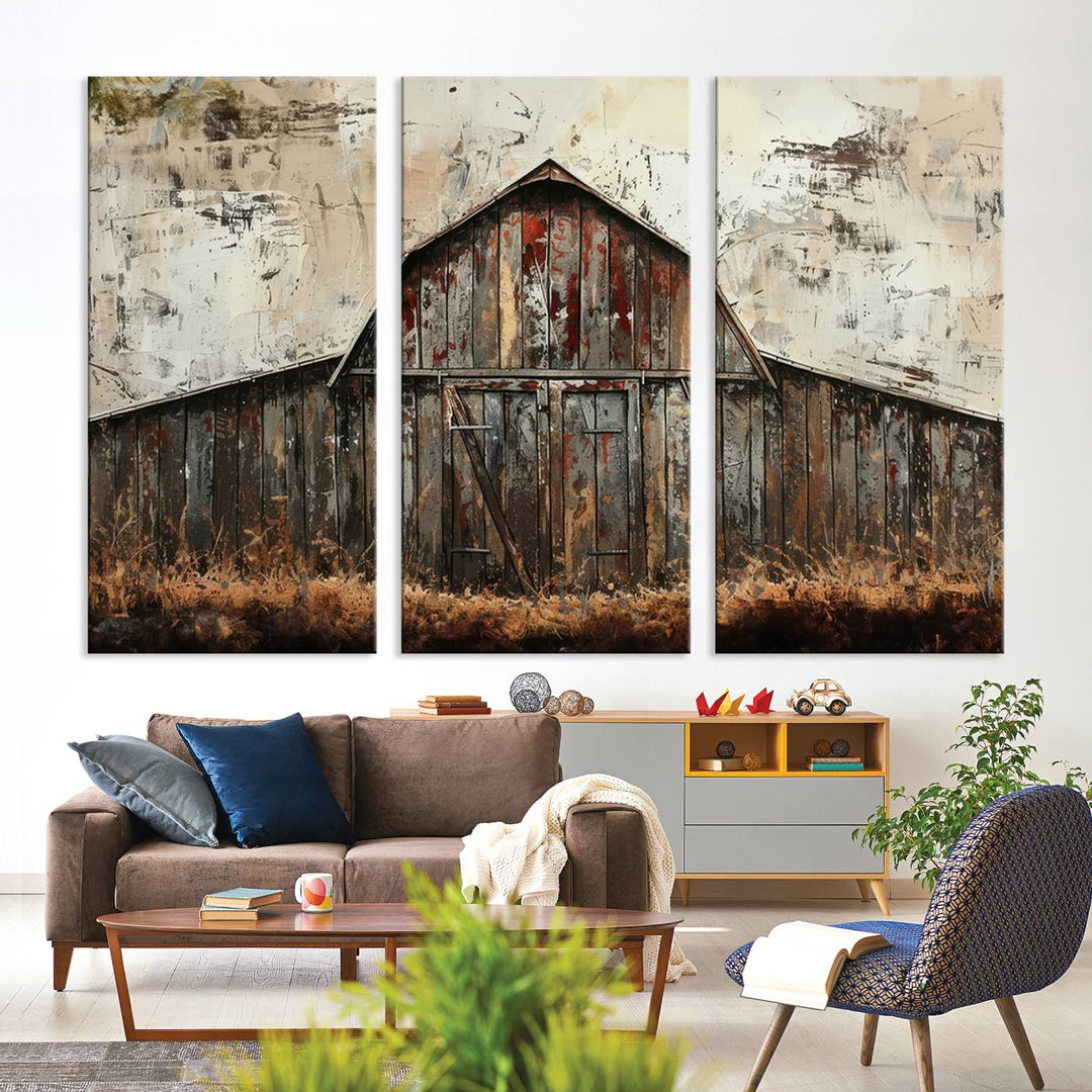 A living room exudes a cozy ambiance with the Rustic Barn Wall Art, a three-panel Farmhouse Wall Decor Canvas Print, perfectly placed to blend harmoniously into the rustic charm of the setting.