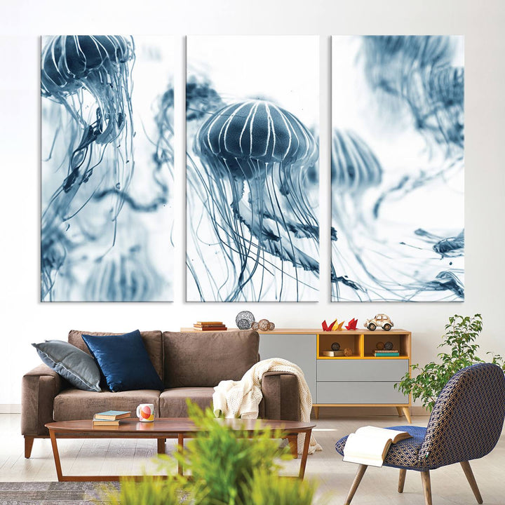 The "Abstract Jellyfish Wall Art Canvas Print" in high resolution is beautifully displayed as a triptych on a dark wall. Experience museum-quality canvas and enjoy free shipping with this stunning piece.