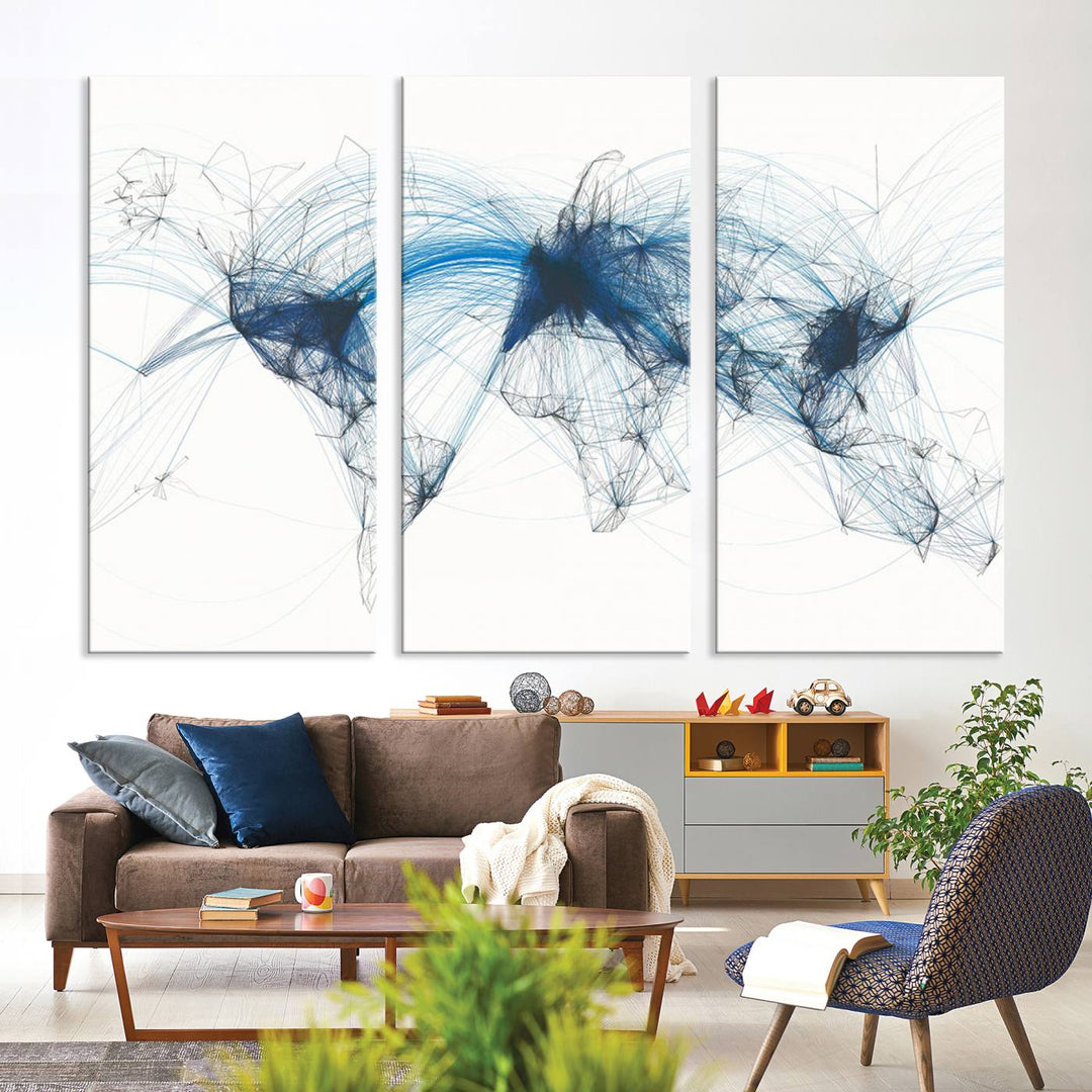 The Aviation Flight Map Wall Art is a set of three abstract panels featuring a world map with blue lines, resembling a flight map. Ideal for aviation enthusiasts, this ready-to-hang framed air traffic art print enhances the appeal of modern decor.