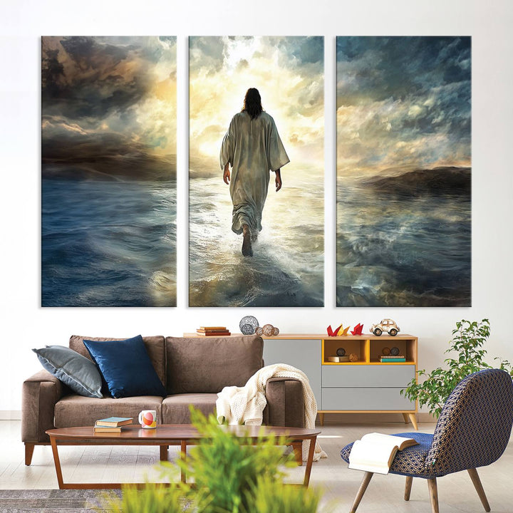 The Jesus Walking on Water Wall Art, a captivating triptych canvas print, showcases a person walking on water beneath dramatic clouds. This ready-to-hang piece seamlessly combines faith and style for your Christian home decor.