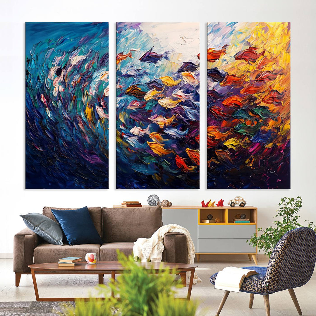 The Vibrant Abstract Fish Swarm Art features a colorful 3-piece canvas that adds a pop of color.