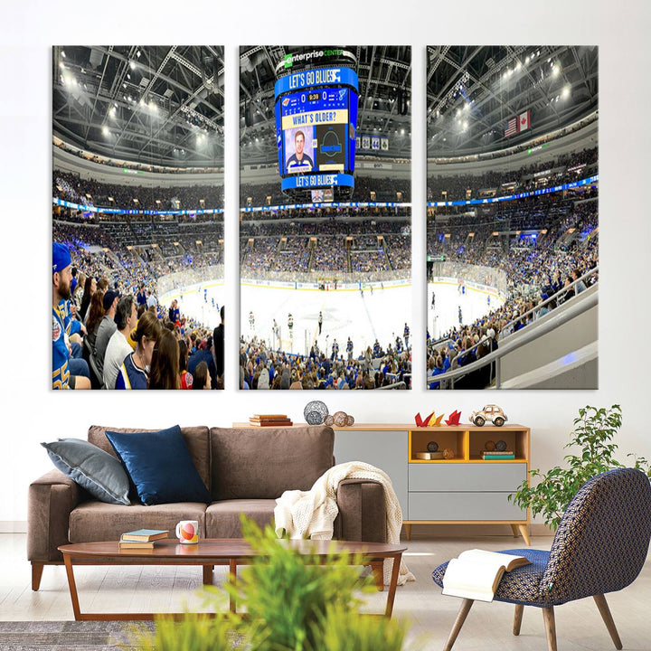 Wall art prints depicting the bustling scenes of the St. Louis Blues being cheered on by a full house at the Enterprise Center, beneath a large scoreboard.