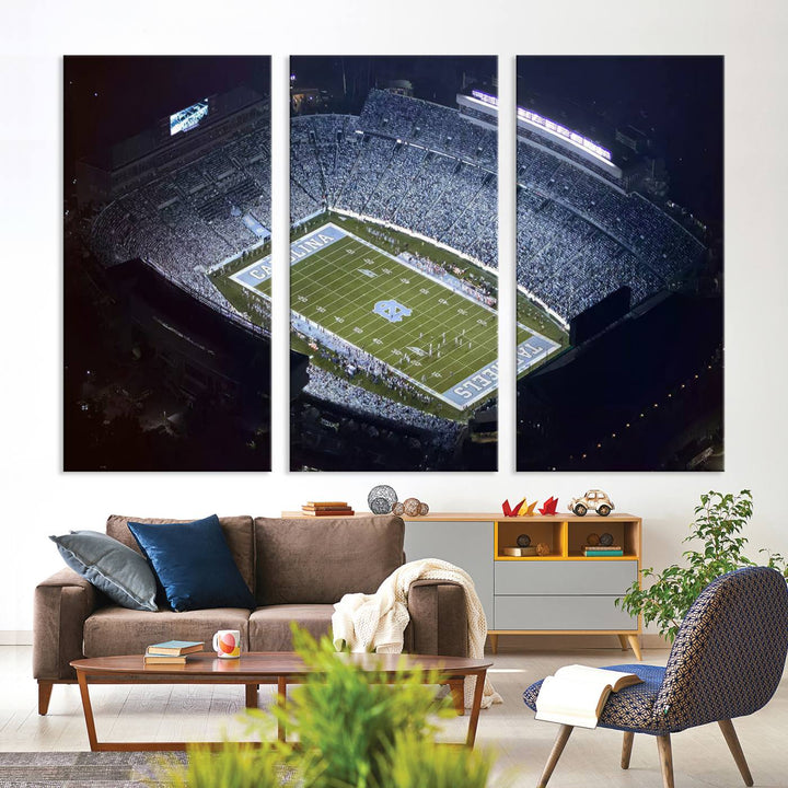 A University of North Carolina Tar Heels Football Team Print, showcasing Chapel Hill's Kenan Memorial Stadium, hangs in a modern dining room, adding a gallery-quality finish that enhances the entire space.