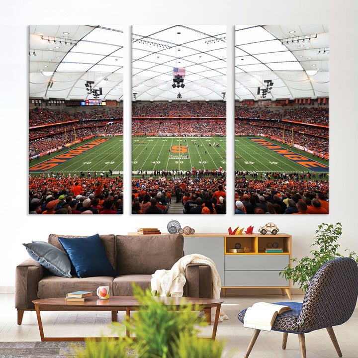 Fans fill the Syracuse JMA Wireless Dome, highlighted in orange and blue under a vaulted roof on this premium canvas print of the scene.